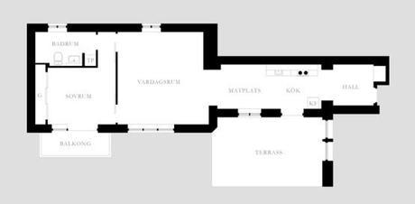 Cocina de forma rectangular sillas Serie 7 de Fritz Hansen sillas Eames DAX de Vitra muebles de diseño estilo nórdico decoración de salones decoración de comedores cocinas nórdicas negro y blanco cocinas modernas negras cocinas alargadas rectangulares
