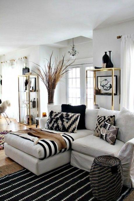 The best thing about this photograph is those brass shelves. I garbage-picked them two weeks ago. Rug, pillows and stool are all Nate Berkus from Target.