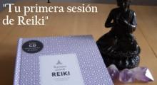 el libro tu primera sesion de reiki junto a una figura de buda y tres puntas de amatista
