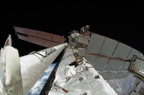 mAY 27 newly-attached 50-foot-long Enhanced International Space Station Boom Assembly (left) is featured in this image photographed by a spacewalker