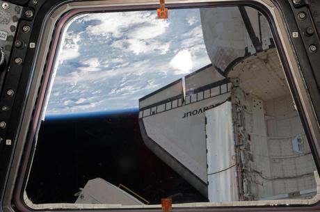 A portion of the docked space shuttle Endeavour is featured in this image photographed by an STS-134 crew member from a Cupola window of the ISS