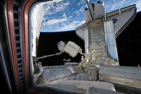 The Alpha Magnetic Spectrometer 2 is transferred from space shuttle Endeavour's payload bay for installation on the station's starboard truss, on May 19, 2011