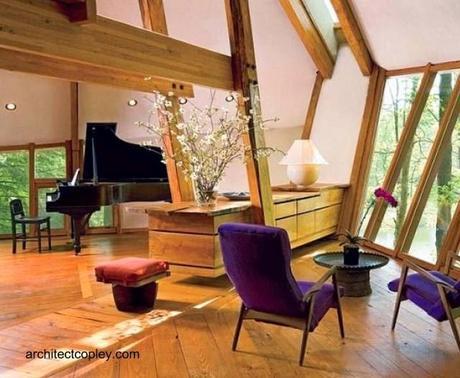 Open plan combina en el espacio elementos rústicos y modernos de fina terminación Vista del interior de la cabaña de arquitectura orgánica en Nueva York