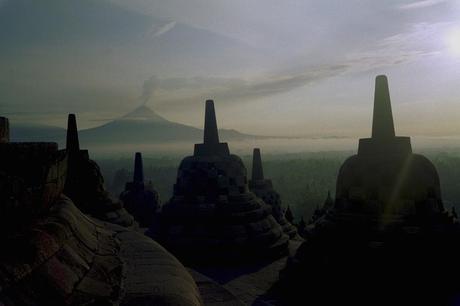 Mt. Merapi erupts from Borobudur horizon