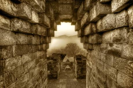 Archway overlooking the foggy jungles of Indonesia - Borobudur