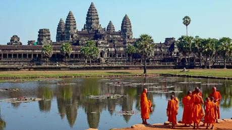 Buddhist monks in front of the reflection pool at Angkor Wat, Cambodia
