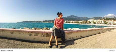 french riviera panorama with beautiful brunette in the middle