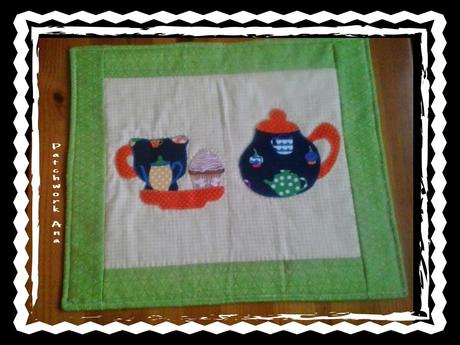 Salva-mantel y alfiletero