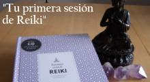 el libro tu primera sesion de reiki junto a una figura de buda y tres puntas de amatista