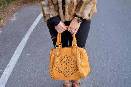 Total black and fur coat.