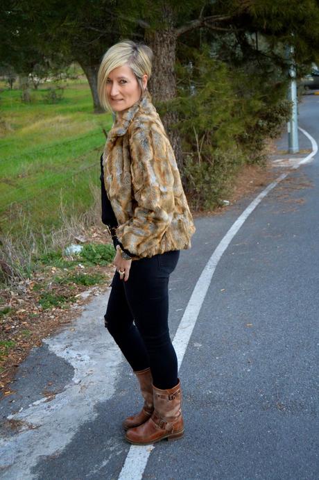 Total black and fur coat.