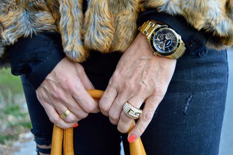Total black and fur coat.