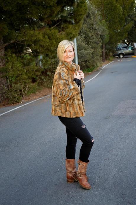 Total black and fur coat.