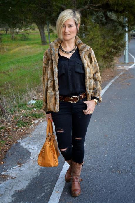 Total black and fur coat.