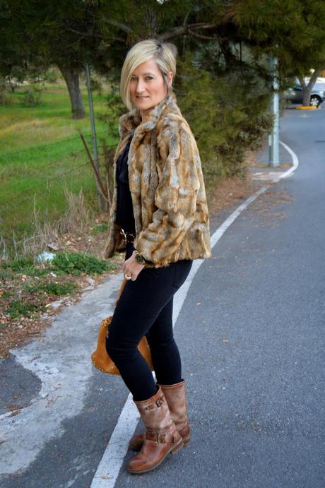 Total black and fur coat.