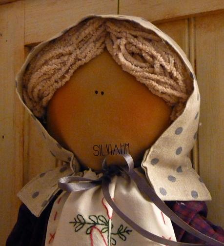 MUÑECA GUARDABOLSAS