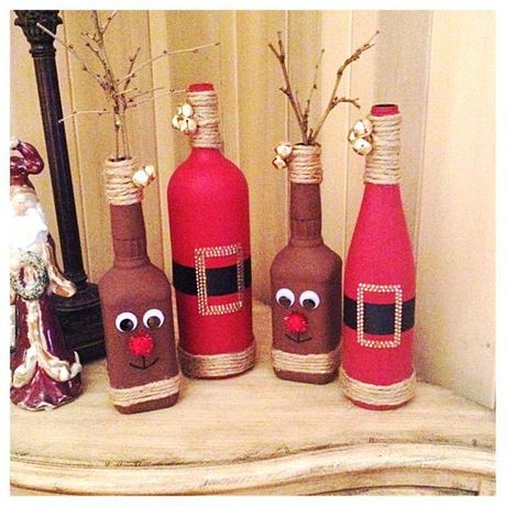 DIY Christmas decor. Reindeer from old whiskey bottles and Santas from old wine bottles.