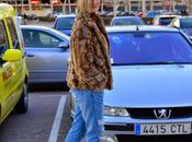 Fluffy coat, animal print ripped jeans. Retro hat.