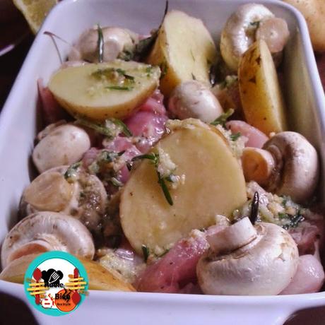 Conejo asado con patatas y champiñones