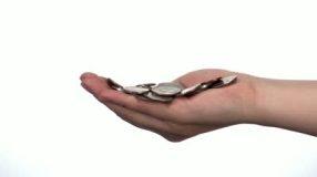 stock-footage-a-hand-full-of-coin-money