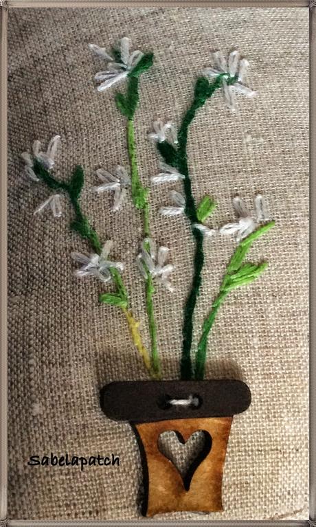 Casita sujeta-puertas, alfiletero