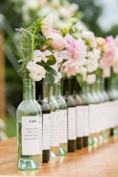 Wine bottle table markers: http://www.stylemepretty.com/connecticut-weddings/north-stonington/2015/03/27/romantic-jonathan-edwards-winery-sunset-wedding/ | Photography: Melani Lust - http://melanilustphotography.com/