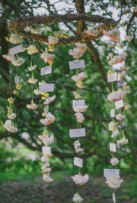 hanging floral escort cards #bohowedding #hangingflowers http://www.weddingchicks.com/2013/12/03/enchanting-boho-chic-wedding/