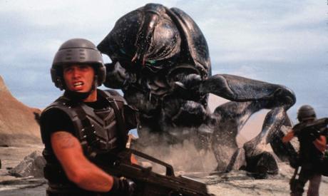 1997 - MOVIE, FILM - STARSHIP TROOPERS. ACTOR CASPER VAN DIEN FACES GIANT TANKER BUG. PHOTO CREDIT: COLUMBIA/TRISTAR PROMOTIONAL HANDOUT  *Calgary Herald Merlin Archive*