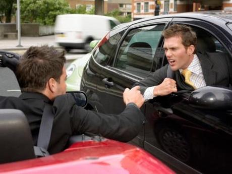 Two Face to Face Businessmen Driving Their Cars Threatening One Another