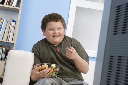 Boy Eating Bowl of Fruit