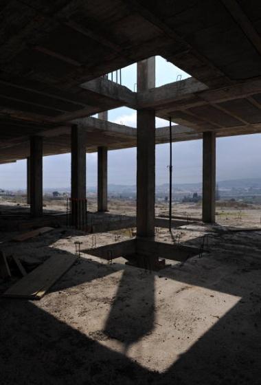 ALMERIA, SPAIN - APRIL 04:  The concrete skeleton of an apartment building under construction stands abandoned at the Pueblo de Luz (City of Light) suburb development on April 4, 2009 in Almeria, southeast Spain. Before the real estate bubble burst, the capital and province of Almeria were booming. During the recent downturn in Spain's economy, regions which are heavily dependent on residential construction and real estate have seen unemployment levels soar. The province of Almeria currently has one of Spain's highest unemployment rates at almost 25 per cent against a nationwide figure of around 13.9 percent.  (Photo by Jasper Juinen/Getty Images)