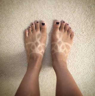tatuaje solar en los pies