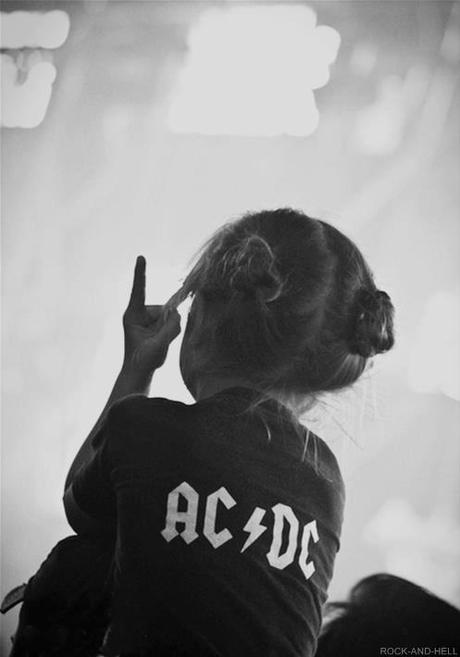 Little girl with an AC/DC shirt! Somebody instilled rock and roll early in the game. Winning.
