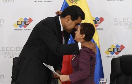 Venezuelan President elect Nicolas Maduro (L) embraces the president of the national electoral council, Tbisay Lucena, in Caracas on April 15, 2013. Venezuela's electoral authorities on Monday confirmed acting President Nicolas Maduro as the winner of the weekend election to succeed Hugo Chavez, despite opposition demands for a recount.
AFP  PHOTO/JUAN BARRETO        (Photo credit should read JUAN BARRETO/AFP/Getty Images)