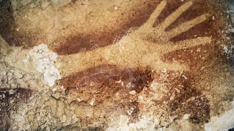 A stencil of an early human's hand in an Indonesian cave is estimated to be about 39,000 years old.