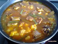 Arroz con costillejas, coliflor y judías tiernas.
