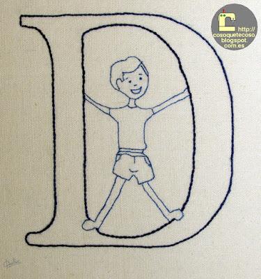 Cojín con la letra D de Vanessa Ouache masculinizada