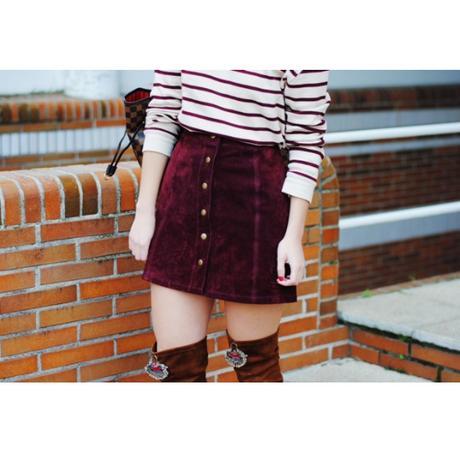 Burgundy skirt.