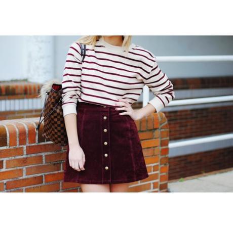 Burgundy skirt.