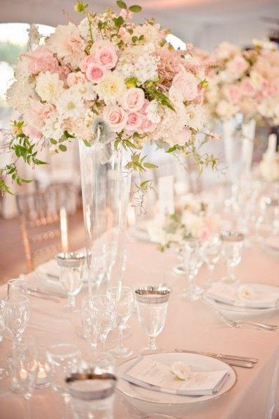 Pantone's rose quartz looks perfect in these tall glass vases and mixed with white and small pops of green.: 