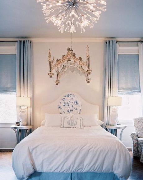Bedroom Photo - An upholstered headboard and white bedding flanked by a pair of owl lamps: 