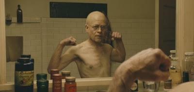 benjamin button mirror medicines brad pitt muscles flex glasses glass bottles bathroom old young