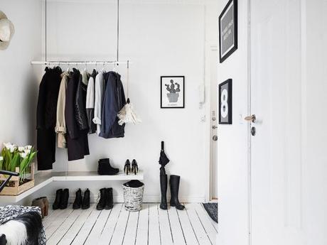 7. DIY wooden coat rack. Note: you can use the boots as an umbrella stand.