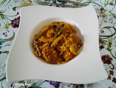 Arroz en paella de sepia, ajos tiernos, ...