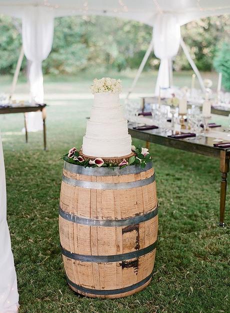 rustic-naked-wedding-cake-on-wine-barrel