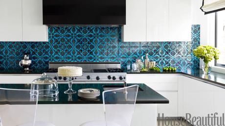 Designers Jeff Lincoln and Hillary Thomas designed the kitchen in a Washington, D.C. town house as a contemporary counterpoint to the rest of the home, which has a '40s French feel. They injected a jolt of color and graphics with a Turkish patterned tile from Ann Sacks and Absolute Black granite countertops. 
