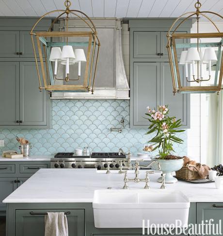 The ocean's shimmery hues inspire a kitchen in Santa Rosa Beach, Florida, by Urban Grace Interiors. The ocean's shimmery hues inspire a kitchen in Santa Rosa Beach, Florida, by Urban Grace Interiors. The blue-green wall tile sets the tone, reminding the designers of verdigris — the color you see on the inside of the brass lanterns.  