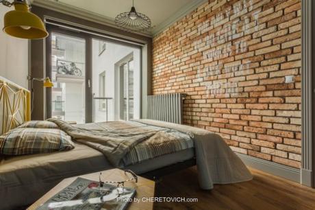 Clásico con toques citricos brick wall bedroom