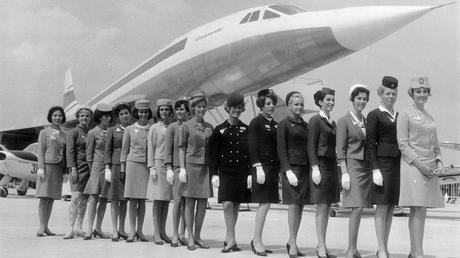 A line-up of some of the air stewardesses who attend to passengers on board the supersonic jet the 'Concorde', each one from a different airline. They are standing in front of a scale model of the aircraft. (Photo by Keystone/Hulton Archive/Getty Images)