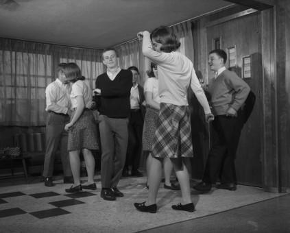 01 Jan 1950 --- 1960s group of young teenagers dancing inside --- Image by © Ewing Galloway/ClassicStock/Corbis